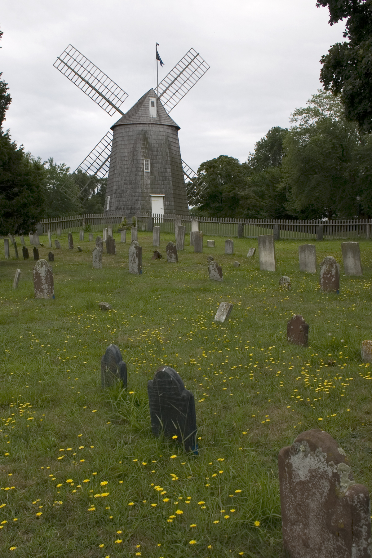 a windmill in a graveyard